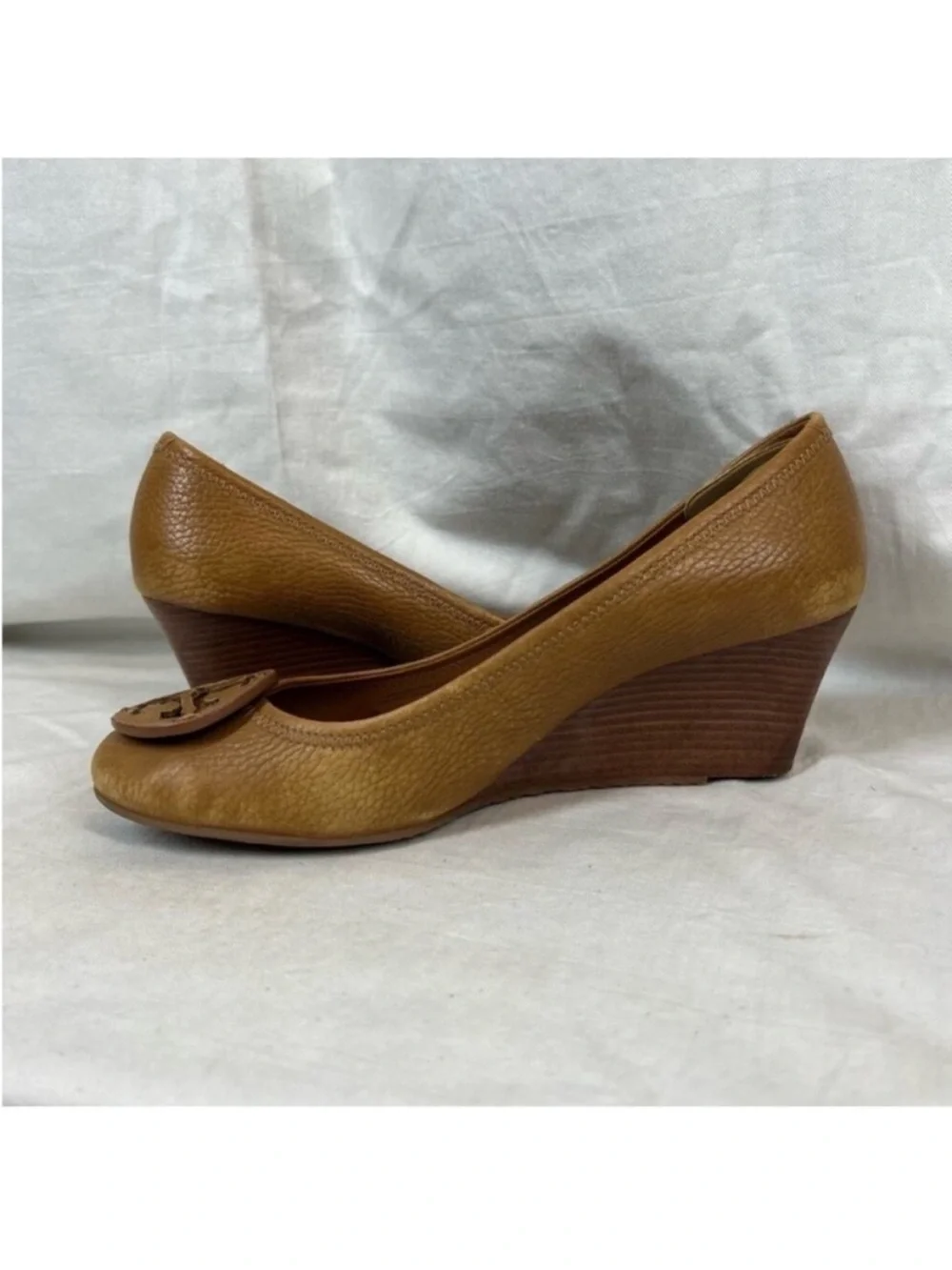 Tory Burch logo round toe brown leather wedge pump